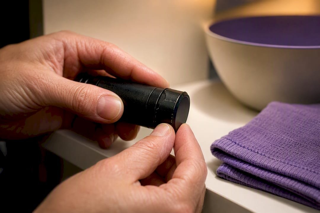 Caregiver checking torch casing for damage